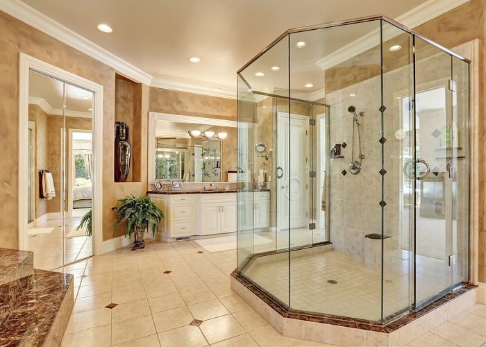 Beautiful Luxury Marble Bathroom Interior In Beige Color Beautiful luxury marble bathroom interior in beige color. Large glass walk in shower. Northwest USA
